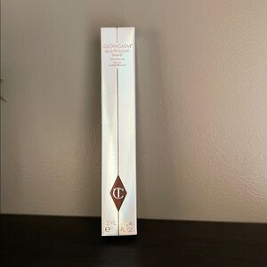 Charlotte Tilbury Glowgasm Highlighter Wand in Pinkgasm.Sealed, no pics of tube.